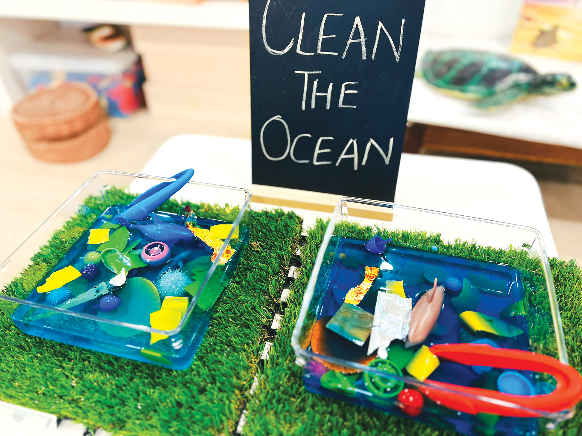 Children's 'Clean the Ocean' sensory play trays with toys and tongs